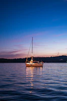 a sailboat floating on top of a large body of water