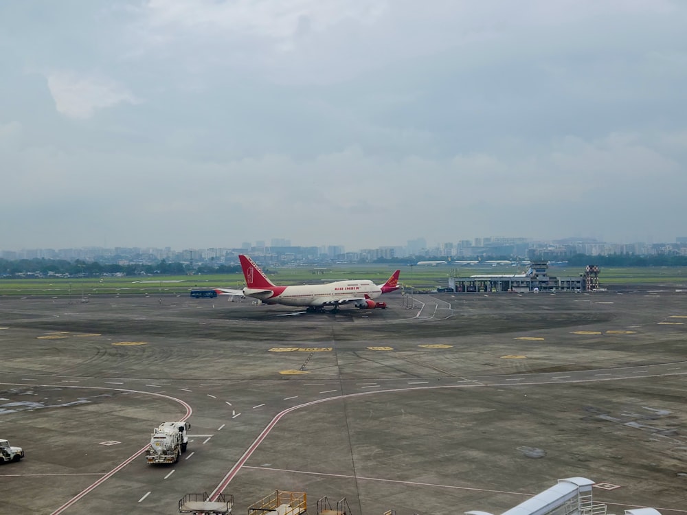 a large jetliner sitting on top of an airport tarmac