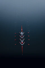 a row of boats floating on top of a body of water
