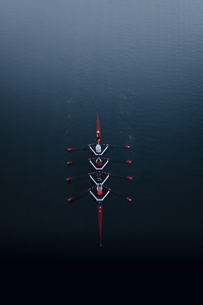a row of boats floating on top of a body of water