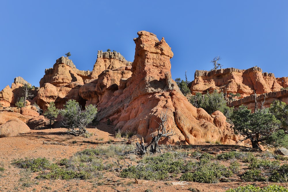 a large rock formation in the middle of a desert