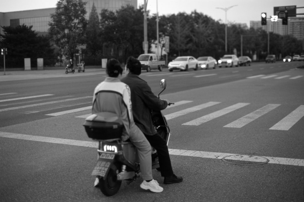 a couple of people that are on a motorcycle