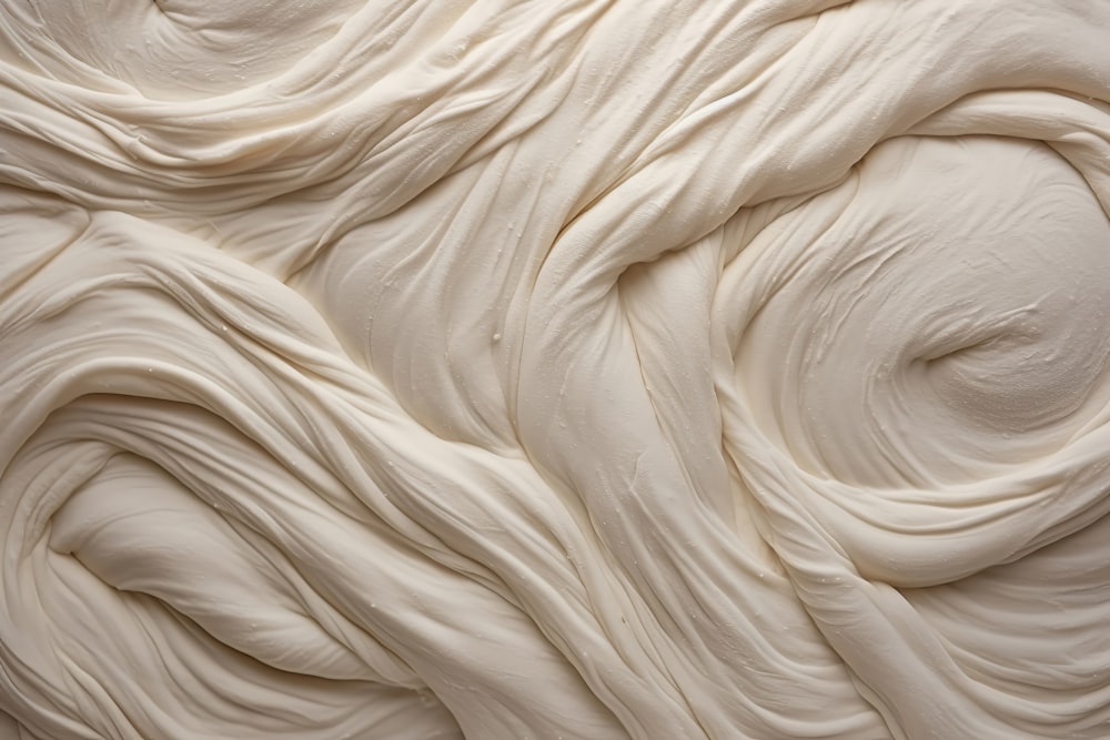 a close up of a cream colored surface
