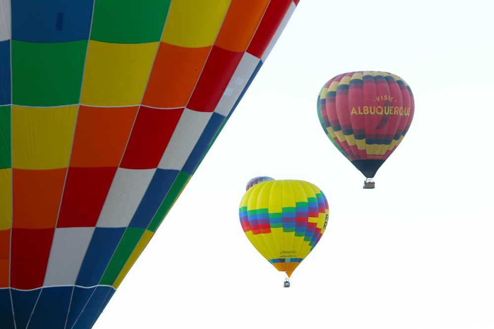 a group of hot air balloons flying in the sky