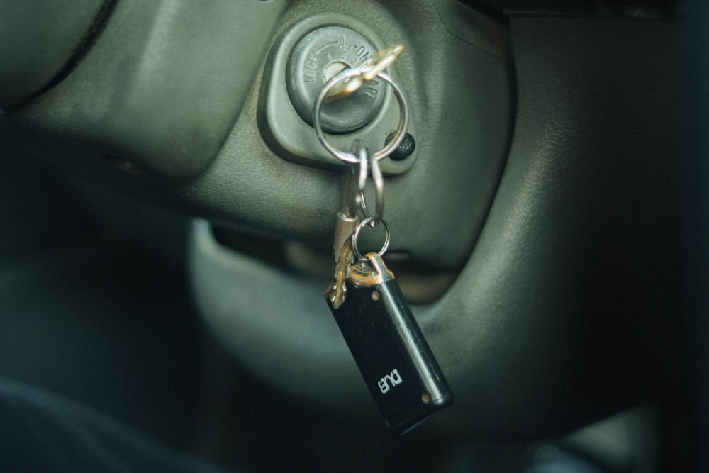 a car door handle with a keychain hanging from it