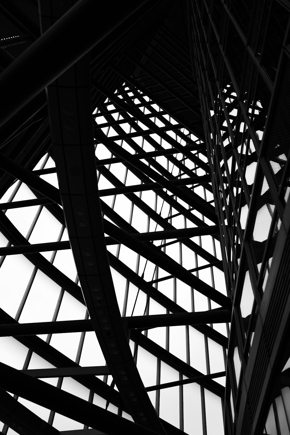 a black and white photo of a building with lots of windows