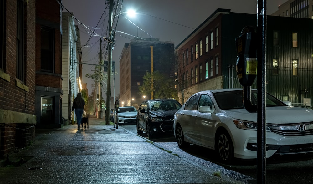 a couple of cars parked on the side of a road