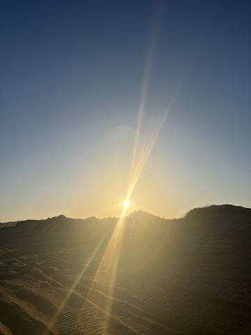 A stunning view of the Sahara Desert at sunset.