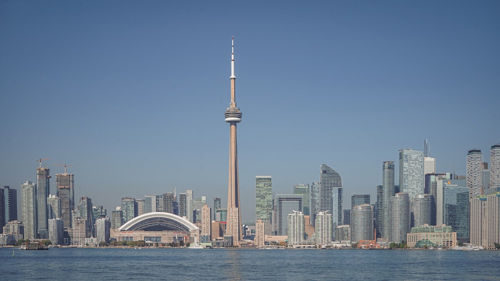 a large body of water with a city in the background