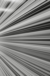 dynamic abstract lines converging to symbolize rapid movement and accelerated progress.