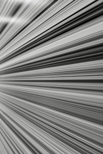 dynamic abstract lines converging to symbolize rapid movement and accelerated progress.