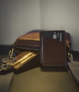 a wallet with a credit card holder on top of it