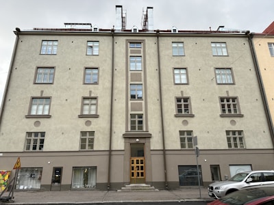 Exterior view of a mixed-use building with neutral colors.
