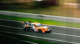 Jorge Solís racing intensely on a TCR México track with his car in motion