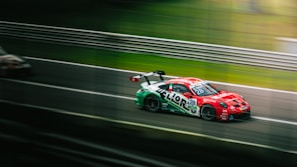 A dynamic racing car speeding on a track.
