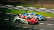 two race cars racing on a race track