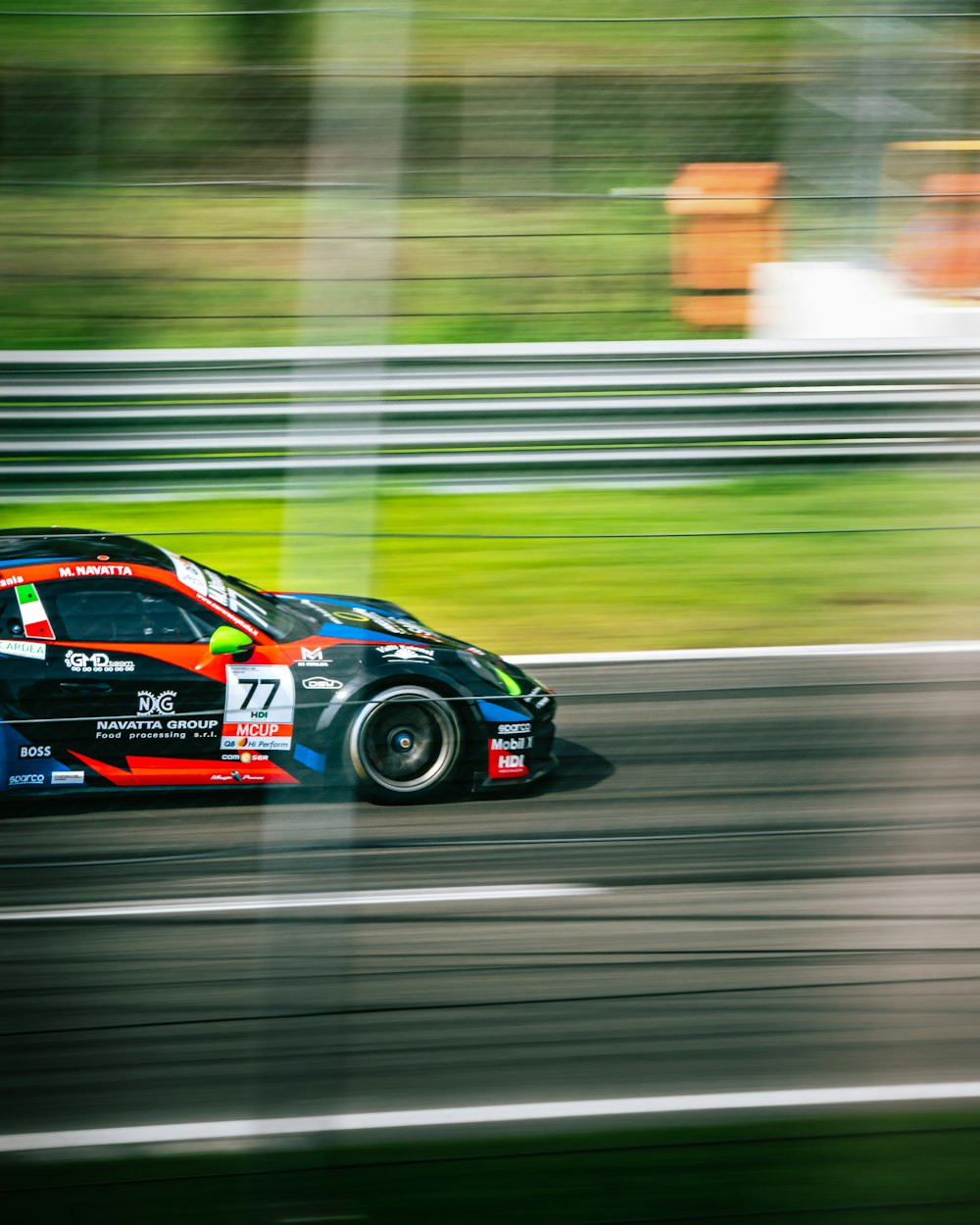 a racing car driving down a race track