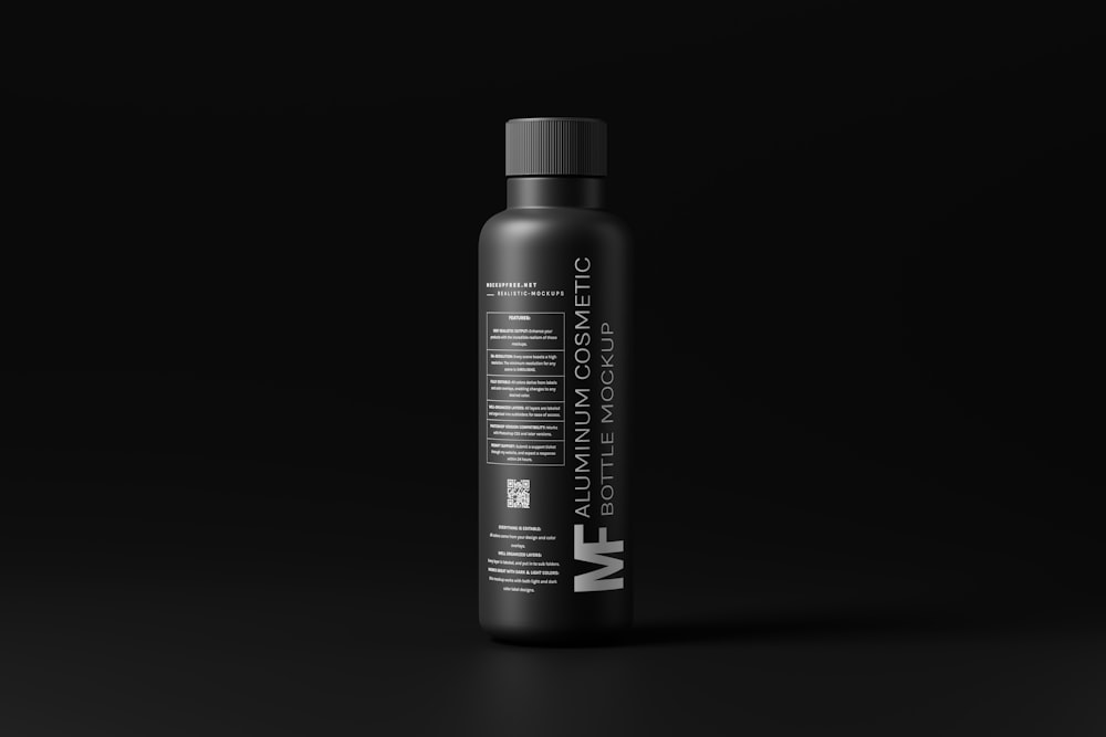 a bottle of vitamin supplement on a black background