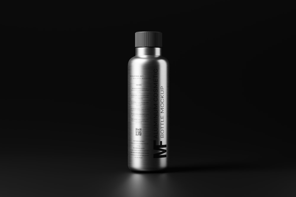 a bottle of water on a black background