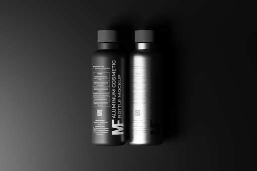 two bottles of shampoo on a black background