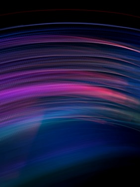 A swirling, colorful abstract background that merges shades of purple, blue, and pink, evoking a psychedelic vibe.