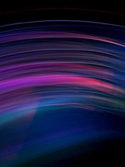 A swirling, colorful abstract background that merges shades of purple, blue, and pink, evoking a psychedelic vibe.