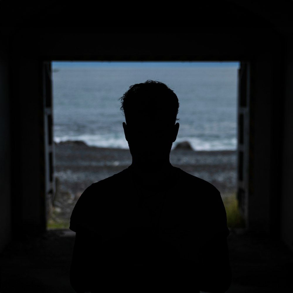 a man standing in front of an open door