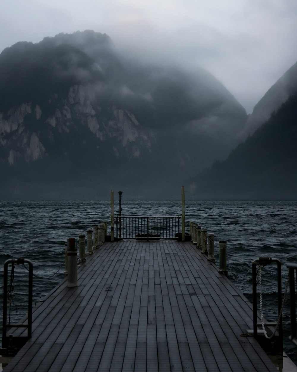 a dock with a mountain in the background