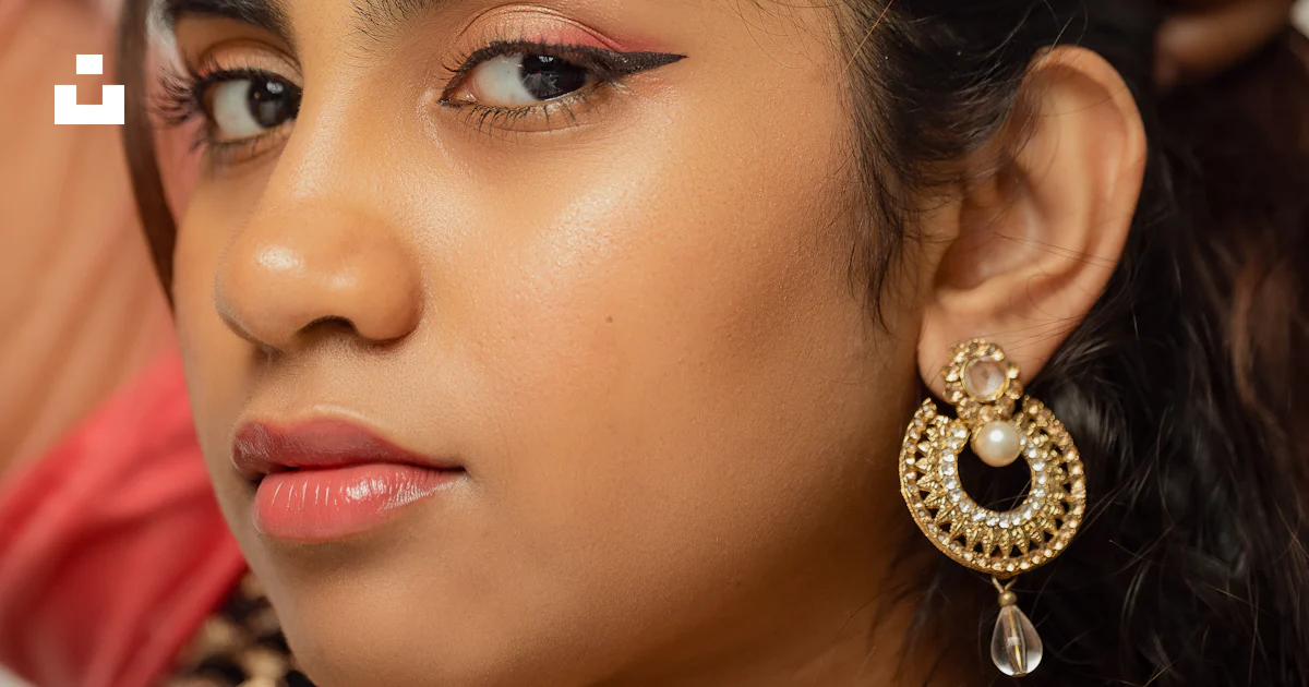 A close up of a person wearing a pair of earrings photo – Free Earring ...