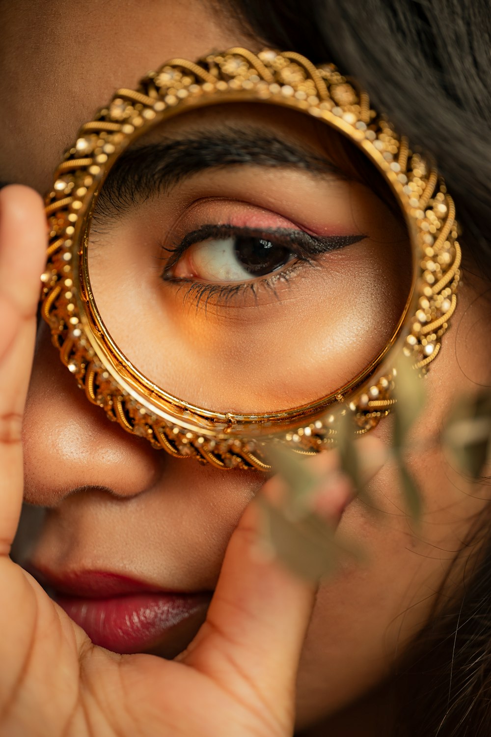 a woman looking through a magnifying glass