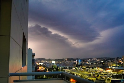 City skyline view from apartment balcony at dusk