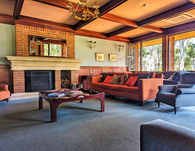 Cozy living room with gold accents and large windows