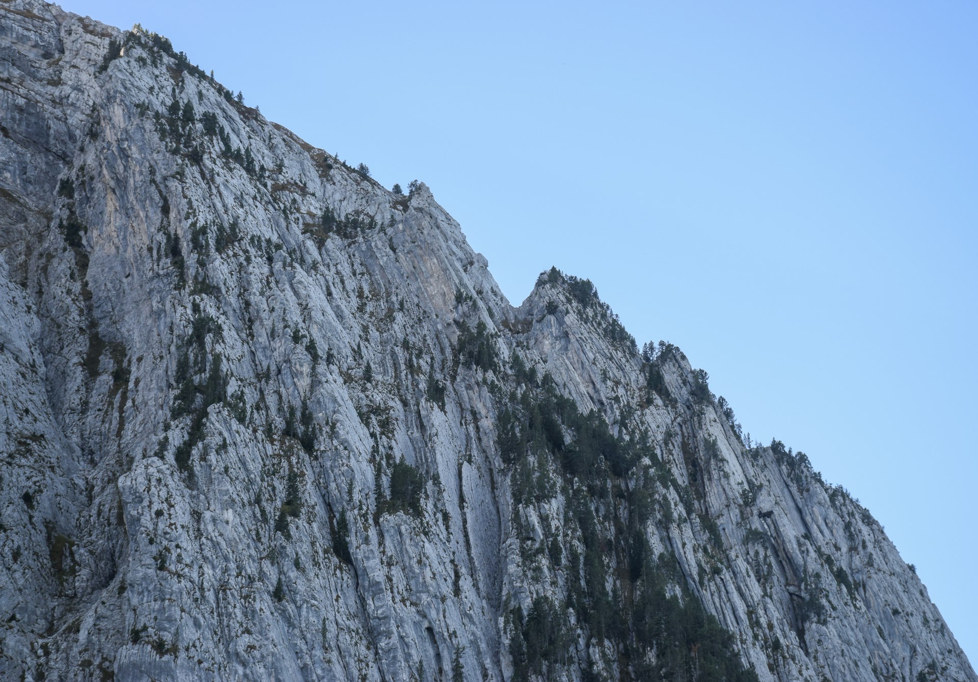 a tall mountain with a sky in the background