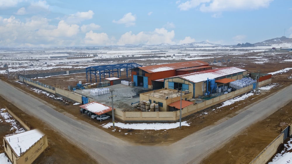 an aerial view of a building in the middle of nowhere