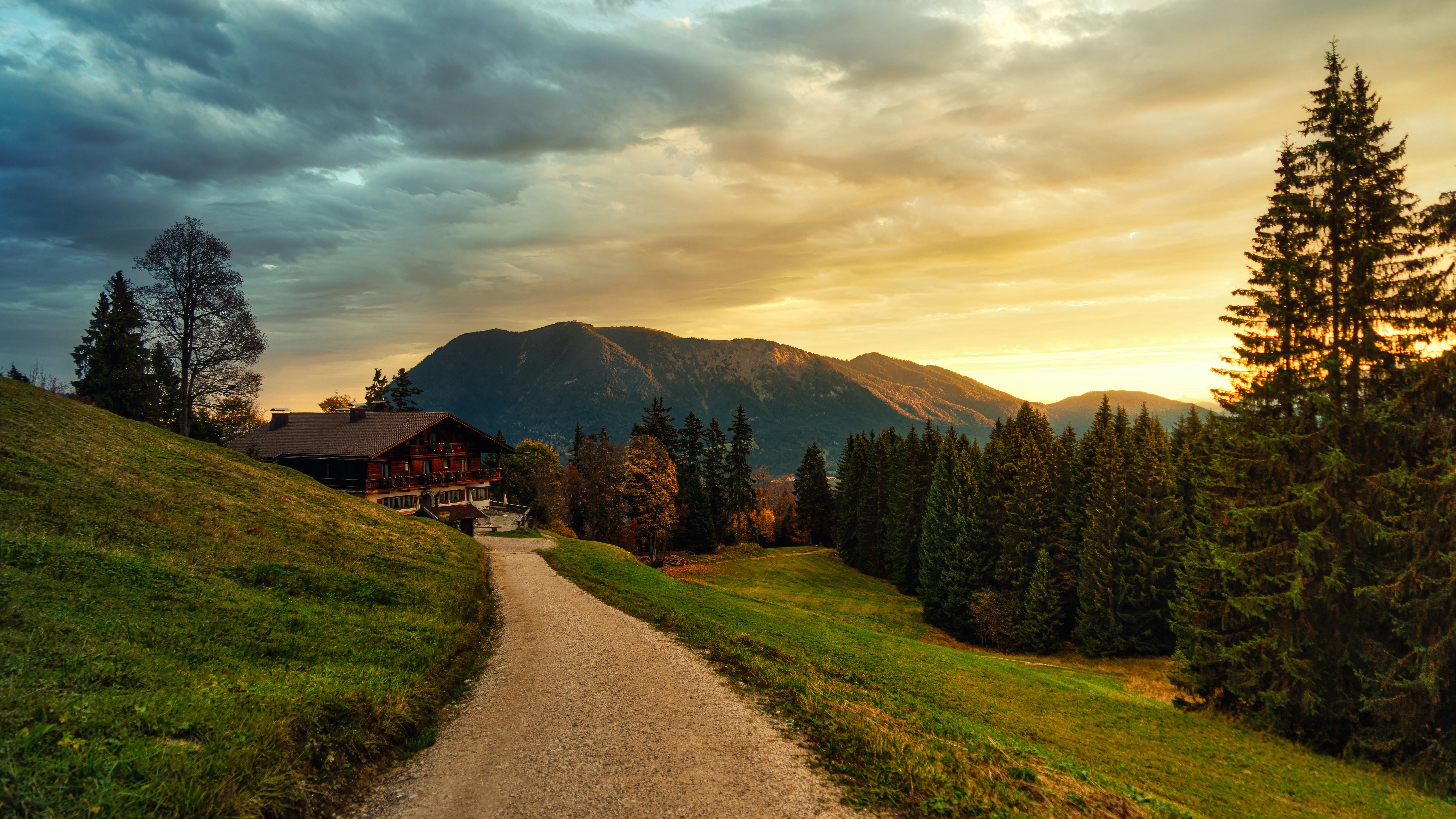 a path leading to a house on a hill