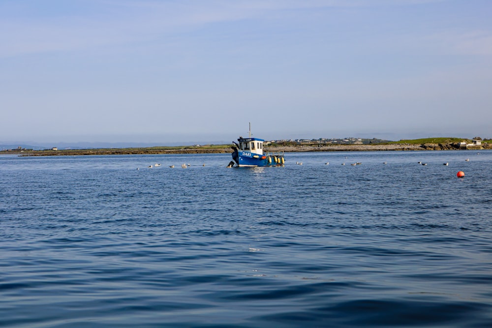 a boat floating on top of a large body of water