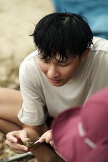 A candid shot of r.c. and r.m. collaborating over a mixed media project blending marine biology and gemology.