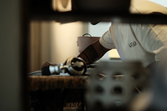 A professional technician assisting a client with equipment setup indoors
