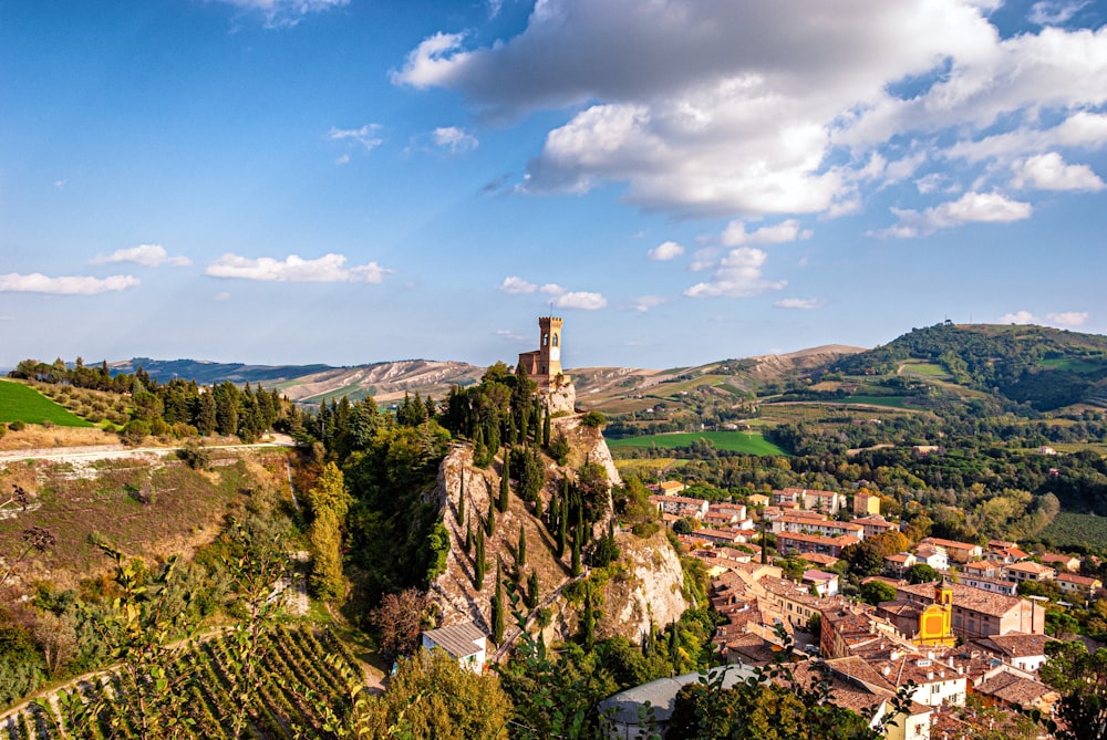 a scenic view of a small town on a hill