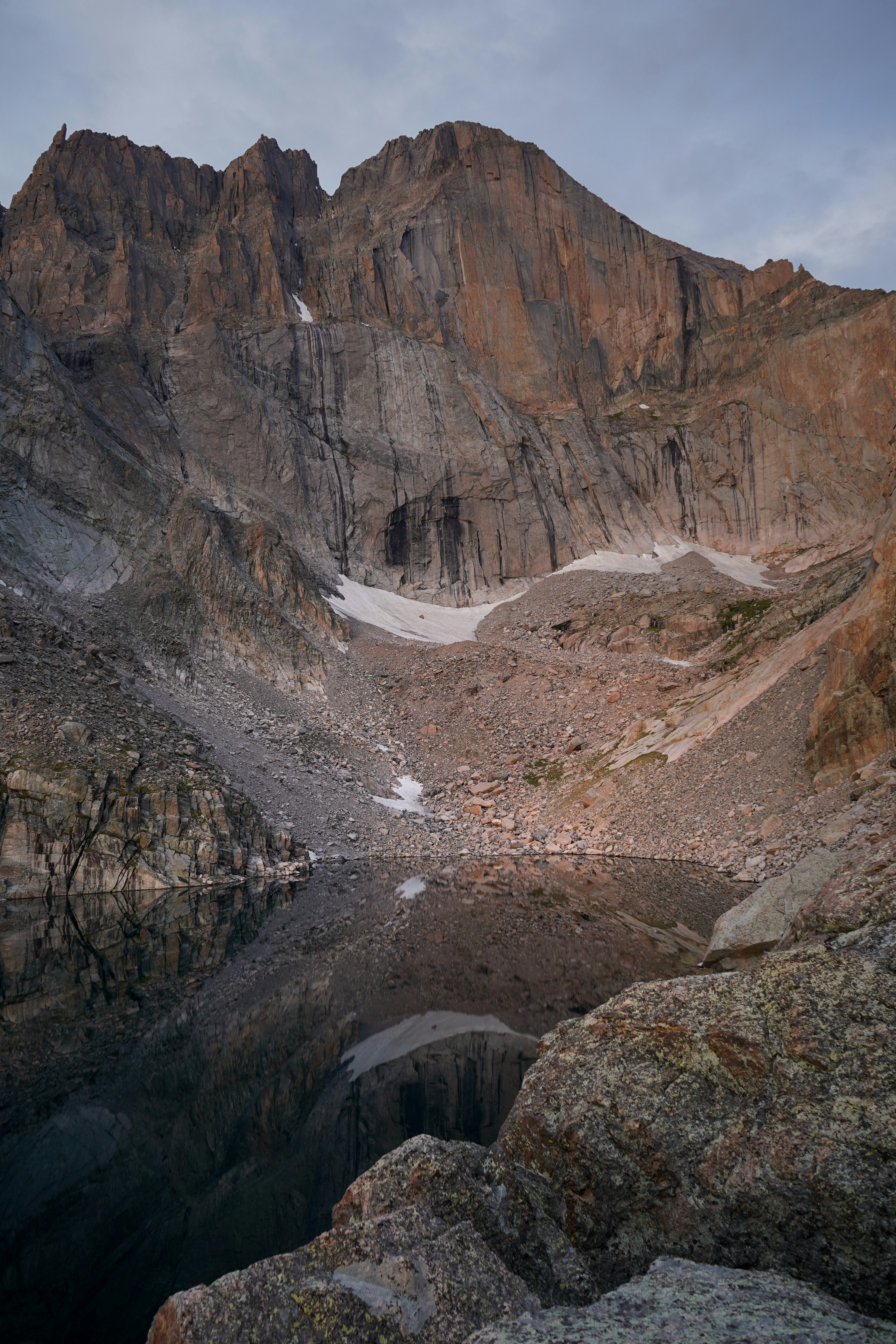 a mountain with a lake in the middle of it