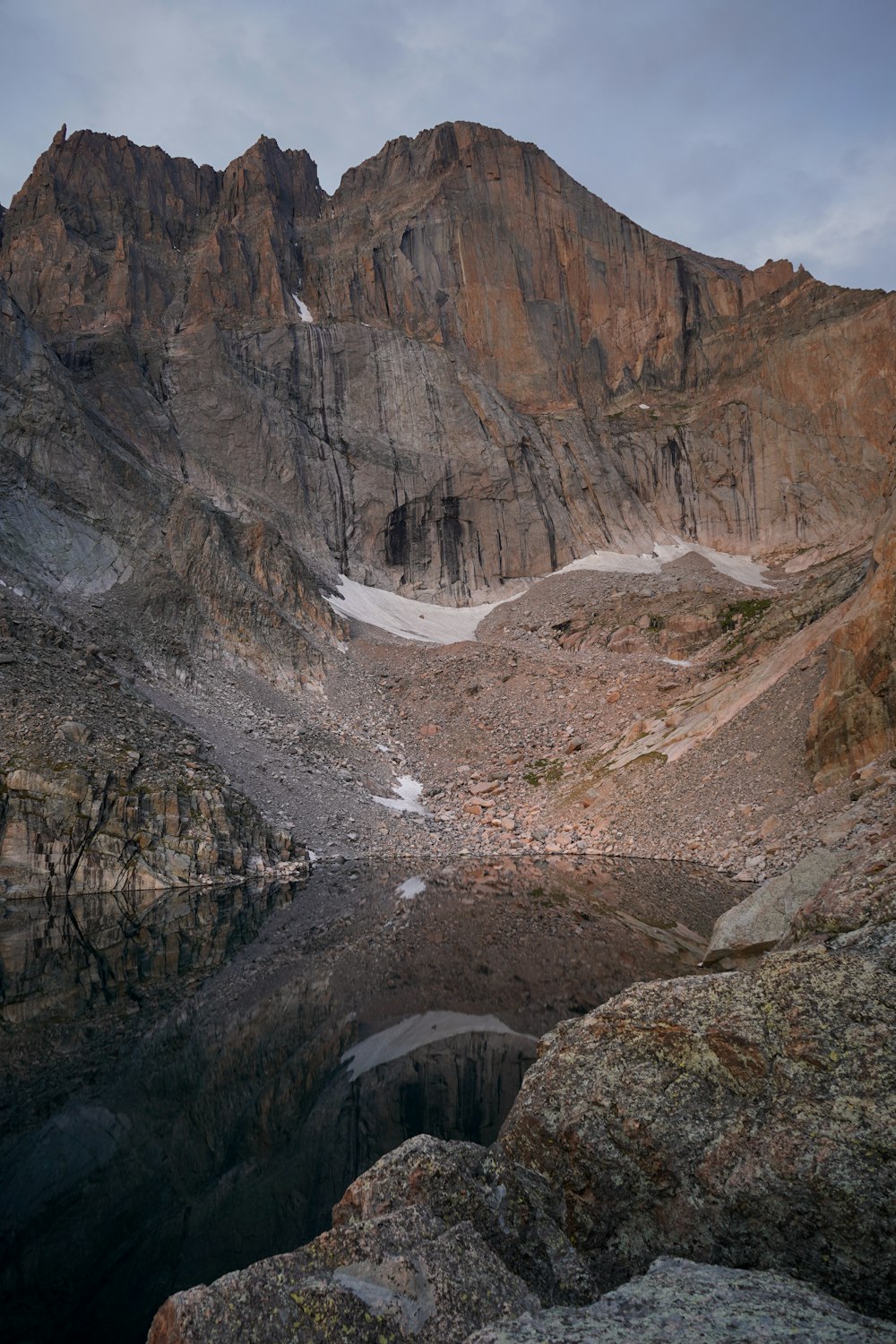 a mountain with a lake in the middle of it