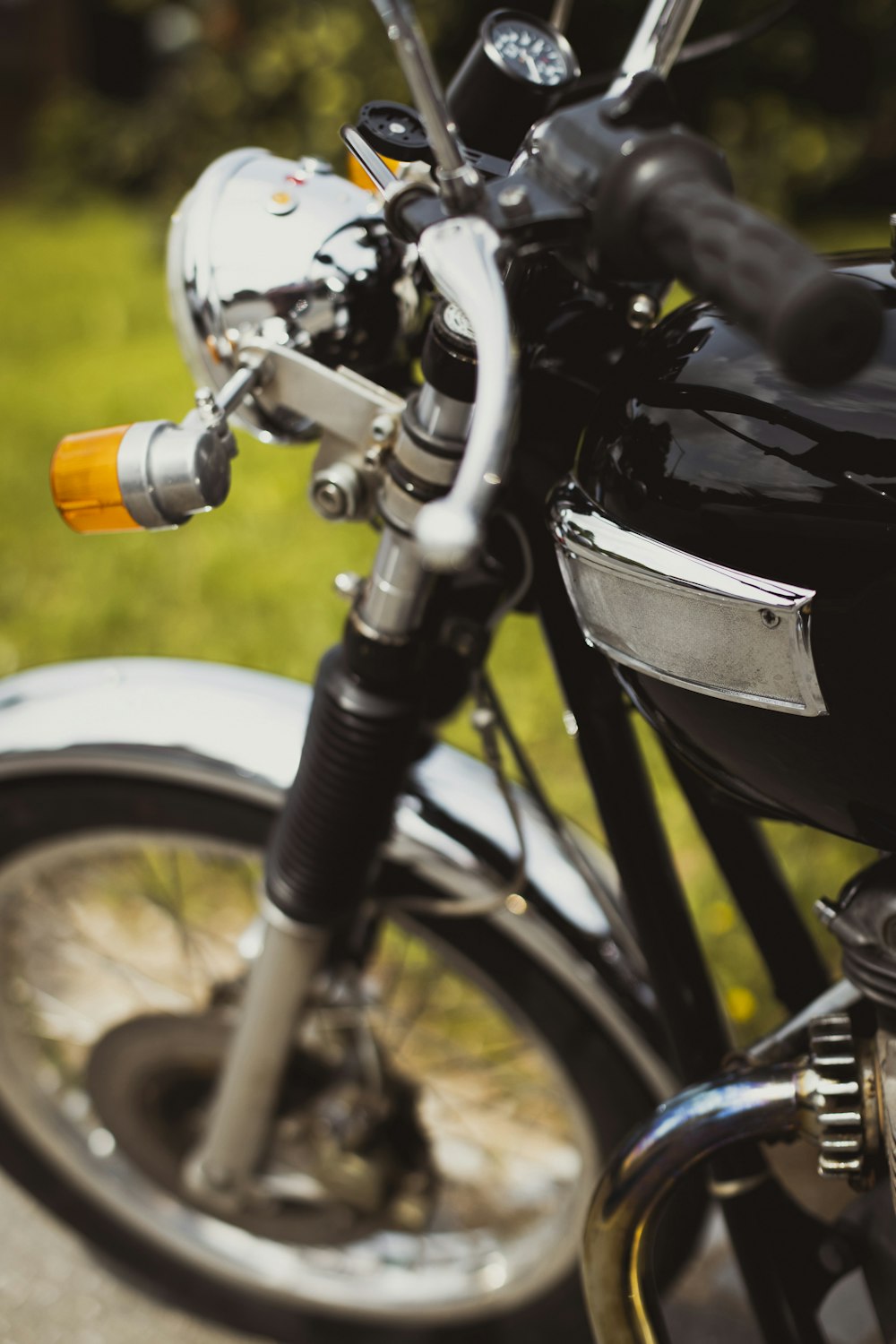 a close up of a motorcycle parked on a street