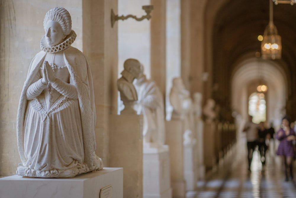 a statue of a woman standing in a hallway