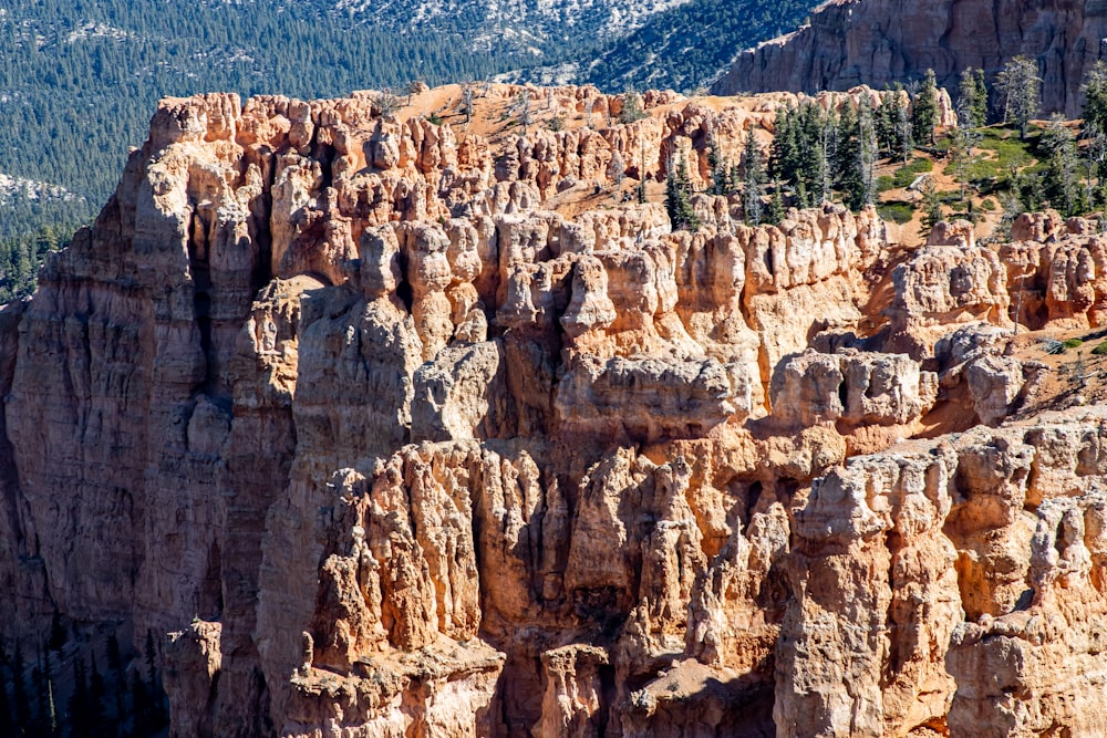 a view of a mountain range with trees and mountains in the background