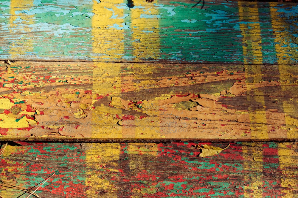 a close up of a painted wooden surface
