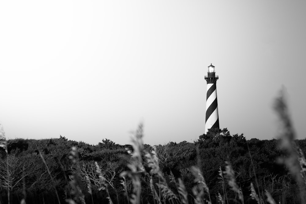 a black and white photo of a lighthouse