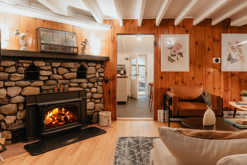 a living room filled with furniture and a fire place