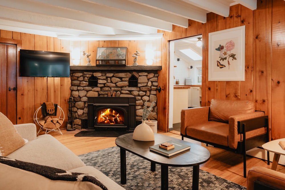 a living room filled with furniture and a fire place