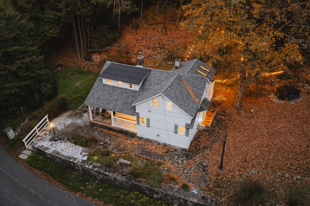 an aerial view of a house in the woods