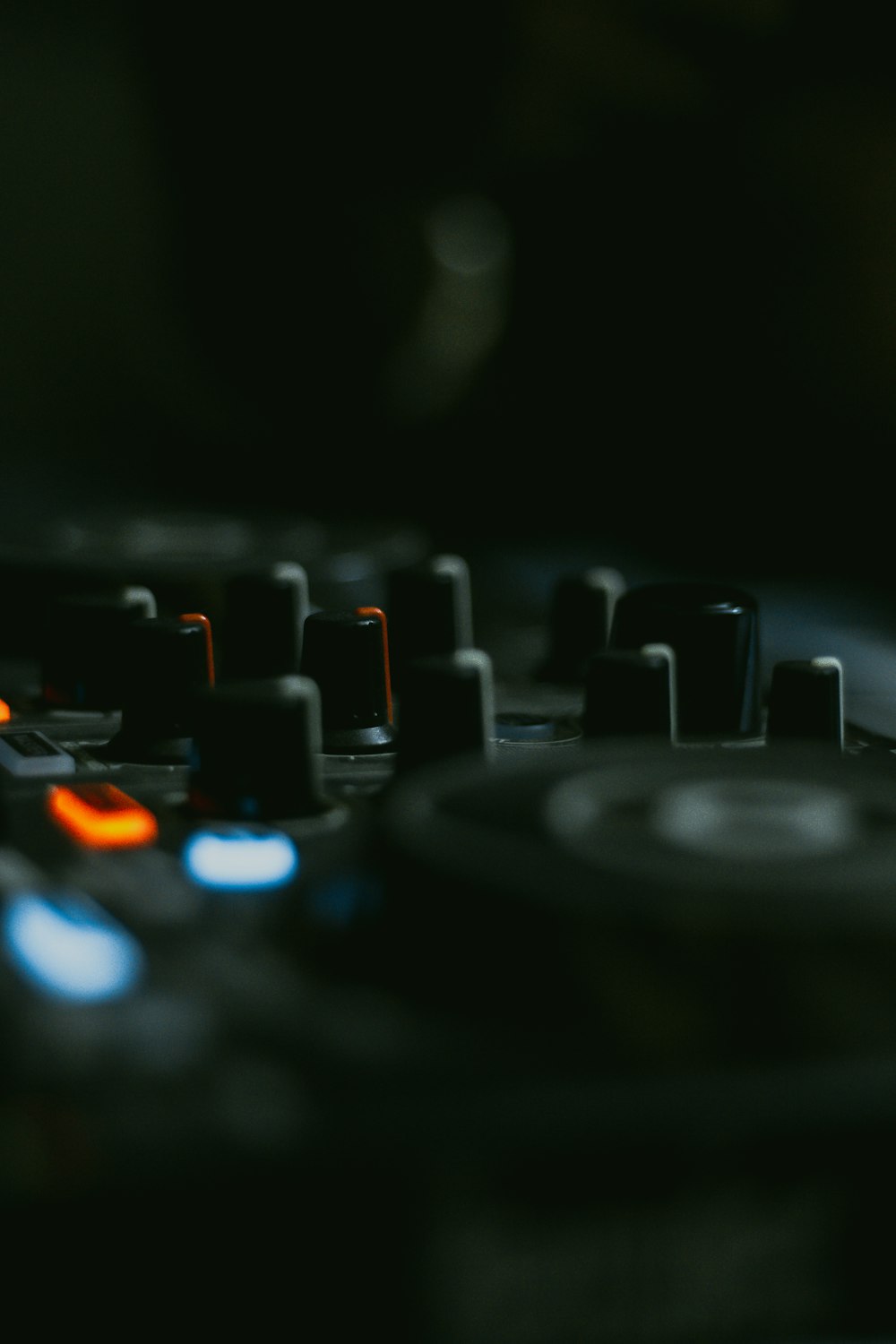 a close up of a dj's turntable in a dark room